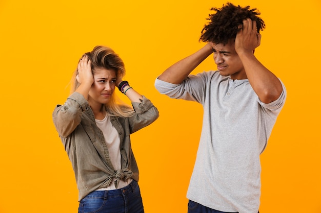 Portrait of a shocked multiethnic couple