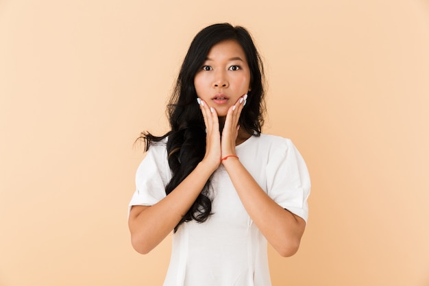 Portrait of a shocked young asian woman