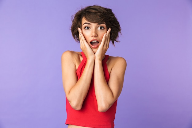 Portrait of a shocked young woman looking at camera
