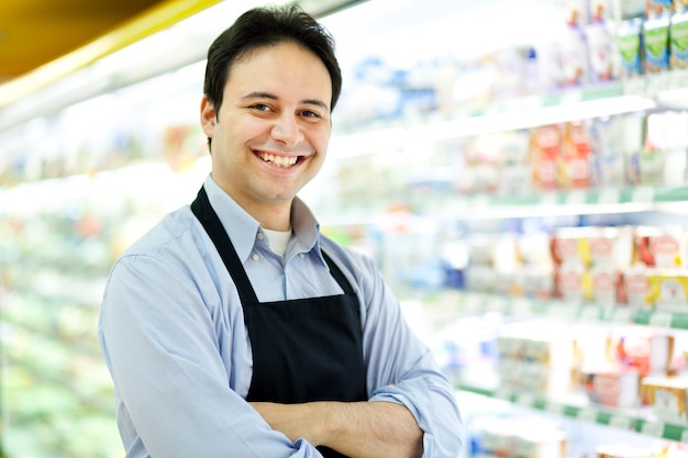 Portrait of a shopkeeper in his store