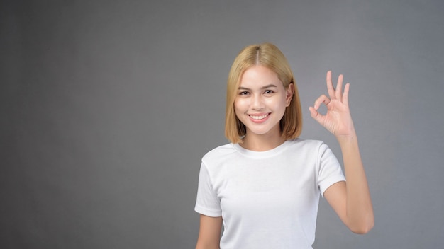 A portrait of short blonde hair woman in studio