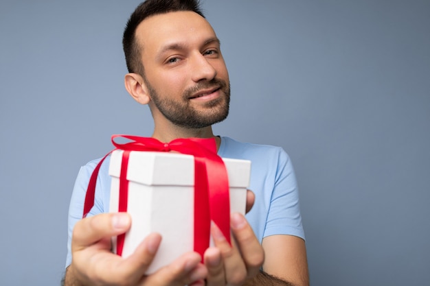 Portrait shot of handsome happy brunette unshaven young male person