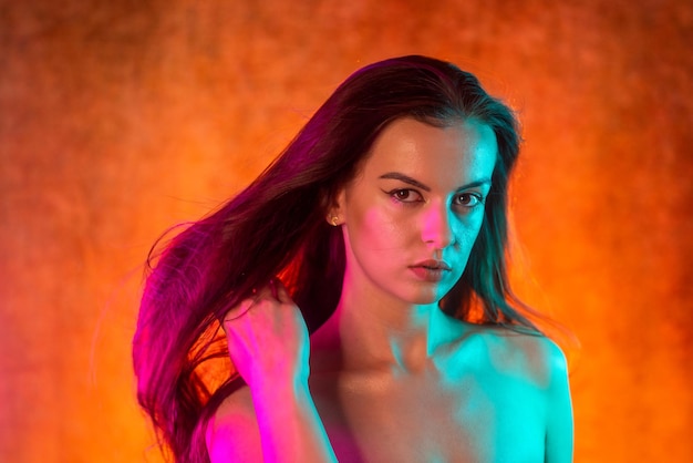 Portrait shot of a pretty young woman in rgb colors