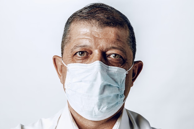 Portrait of a sick adult man in medical mask. Coronavirus pandemia concept