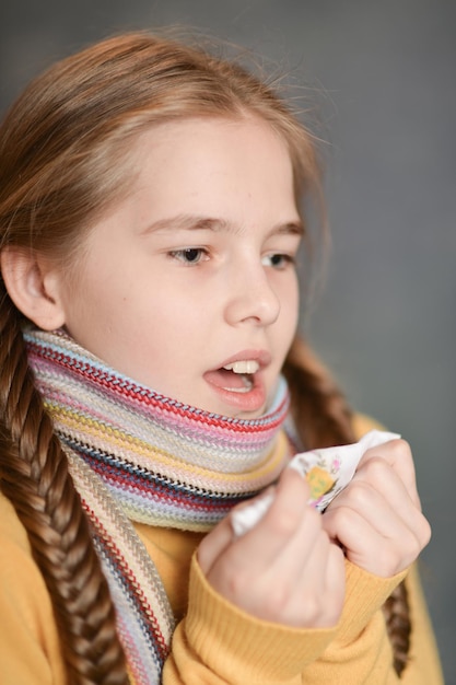 Portrait of a sick girl wearing scarf