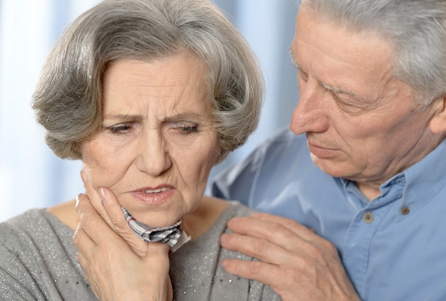 Portrait of a sick senior woman and her  husband