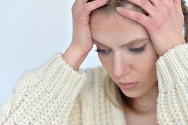 Portrait of Sick woman with headache at home