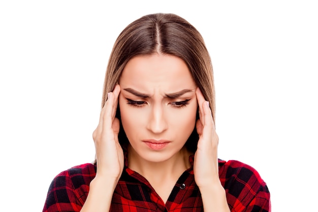 Portrait of sick young woman having strong headache