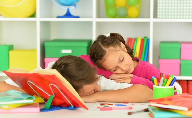 Portrait of sleeping boy and girl in room