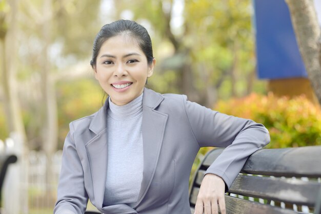 Portrait of smart asian businesswoman sitting