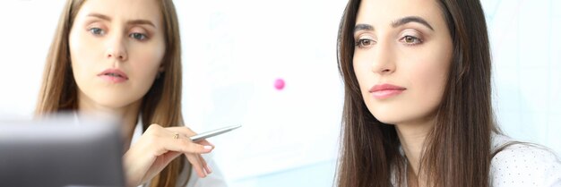 Portrait of smart businesswoman sitting at comfortable workplace