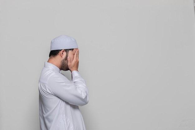 Portrait of smart handsome muslim man on white backgroundRamadan festival concept