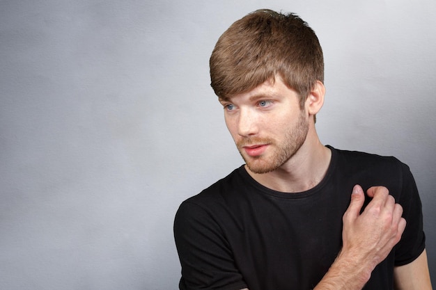 Portrait of a smart serious young man