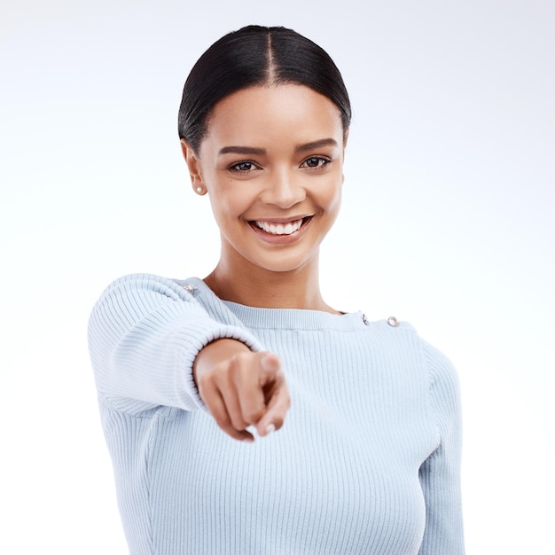 Portrait smile and woman pointing to you motivation and decision against white studio background Face female and person with gesture choice and promotion with happiness opportunity or selection