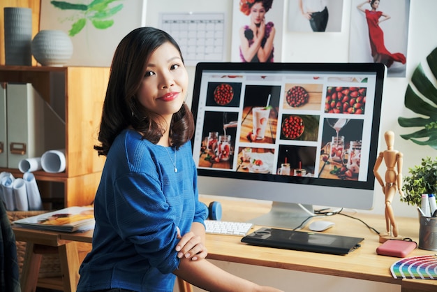 Portrait Of Smiling Asian Stock Photo Designer