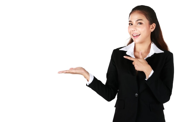 Portrait of Smiling Asian woman is beautiful standing wearing black suit. Businesswoman showing welcoming gestures in white background. Concept welcome business with white isolated.