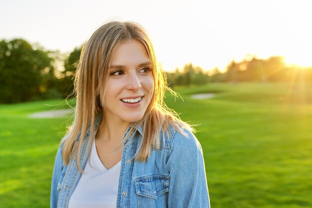 Portrait of smiling beautiful happy young woman 20 years old copy space