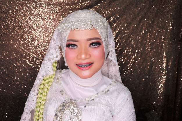 Portrait of a smiling beautiful woman wearing a wedding dress