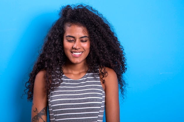 Portrait of smiling black woman with afro hairstyle  