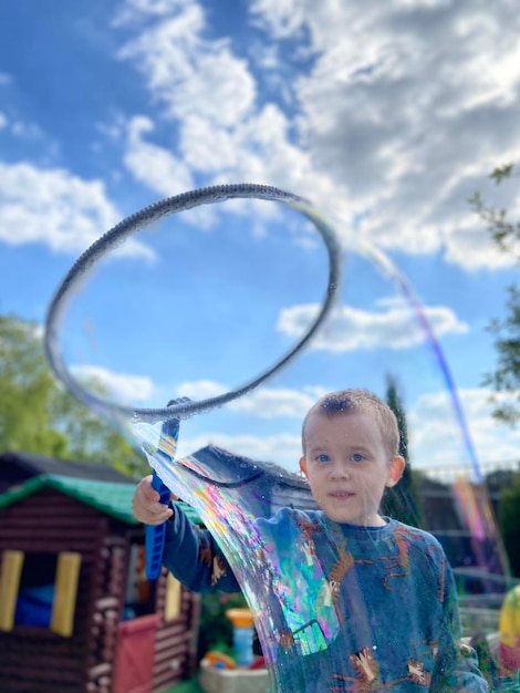 Portrait of smiling boy against sky