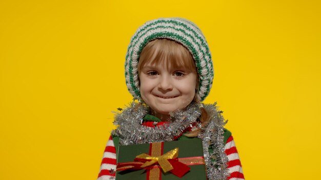 Portrait of smiling boy against yellow background