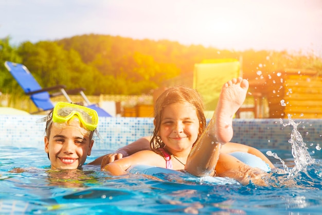 Portrait of smiling boy swimming in pool