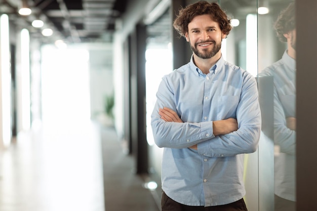 Portrait of smiling business man posing looking at camera