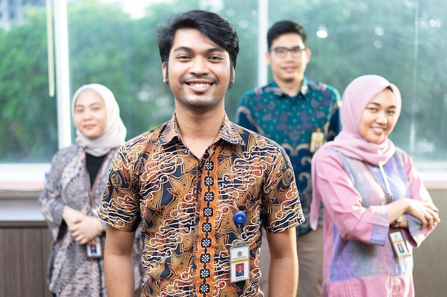 Portrait of smiling business people standing in office