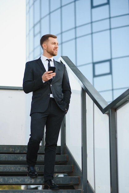 Portrait of a smiling businessman in a modern business environment