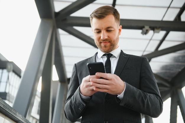 Portrait of a smiling businessman in a modern business environment