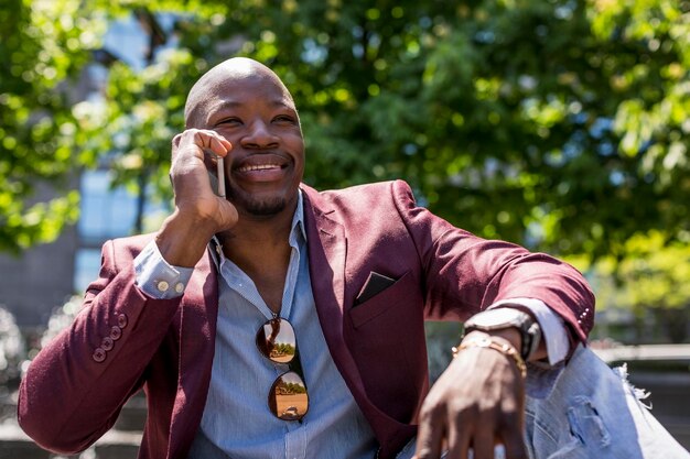 Portrait of smiling businessman on the phone