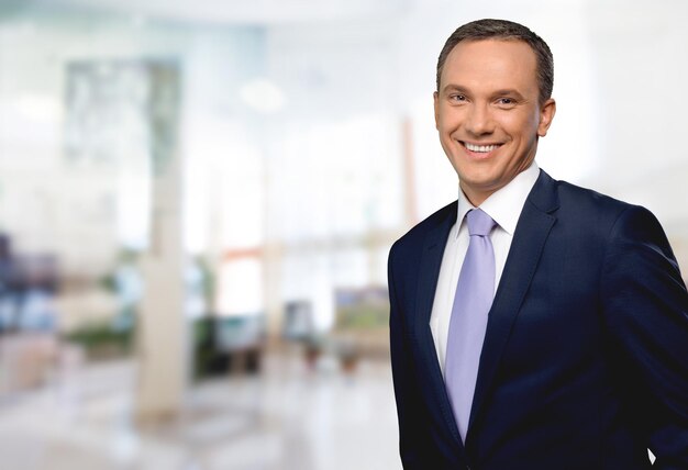 Portrait of smiling businessman in stylish suit