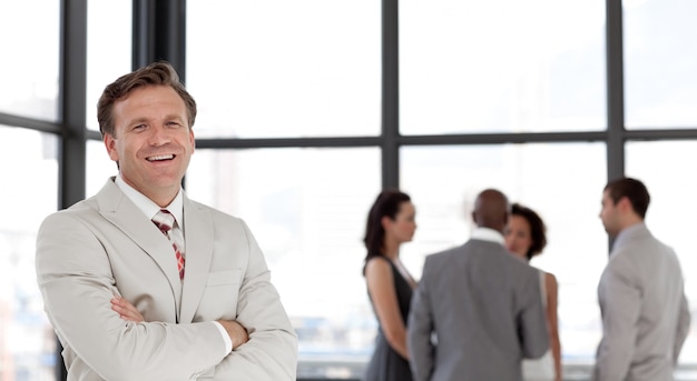 Portrait of a smiling businessman with his team