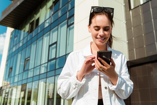 Portrait of smiling caucasian woman with white teeth chatting on phone