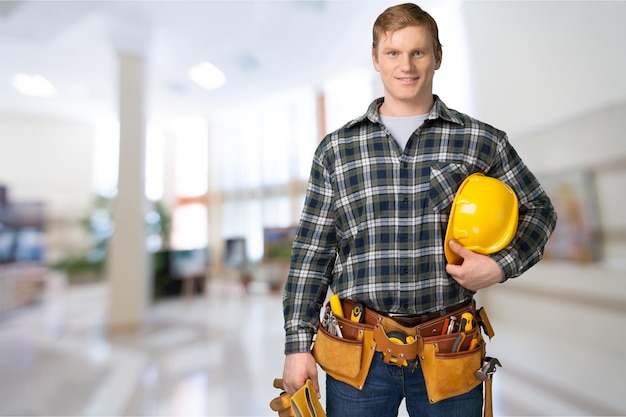 Portrait of smiling confident construction worker wearing hard hat