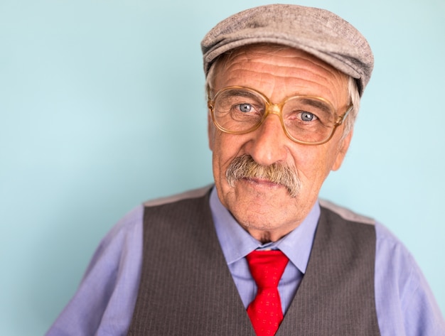 Portrait of a smiling and confident mature businessman with mustache and gray hair