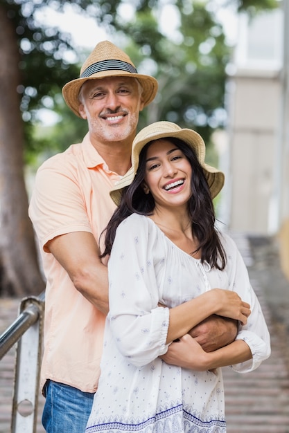 Portrait of smiling couple embracing