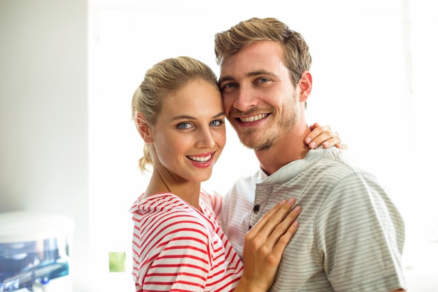 Portrait of smiling couple in kitchen