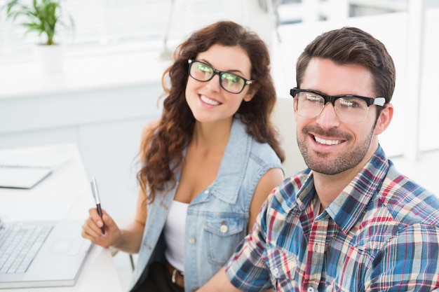 Portrait of smiling coworkers with glasses