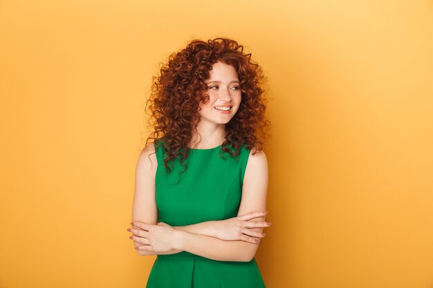 Portrait of a smiling curly redhead woman