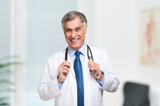 Portrait of a smiling doctor in his studio