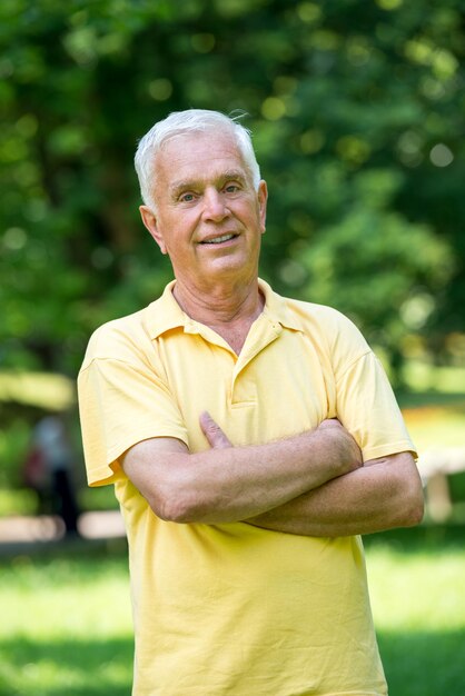 Portrait of smiling elderly man outdoor in park