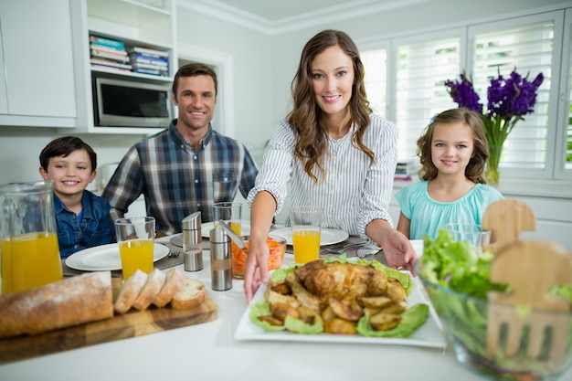 Portrait of smiling family having lunch together on dining table