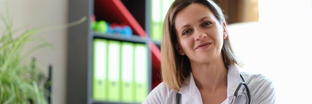 Portrait of smiling female doctor in clinic