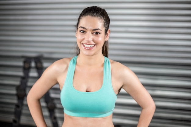 Portrait of smiling fit woman at gym