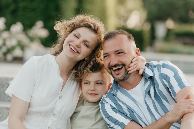 Portrait of smiling friends standing against trees