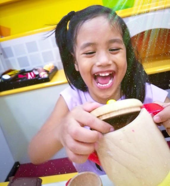 Portrait of smiling girl holding ice cream