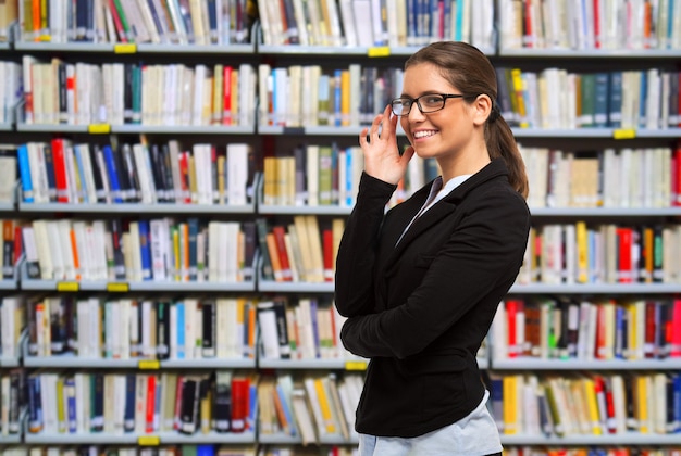 Portrait of a smiling girl in a library