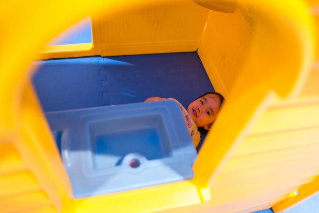 Portrait of smiling girl seen through window