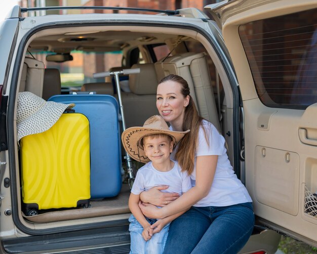 Portrait of a smiling girl sitting in car